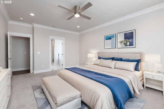 carpeted bedroom featuring ceiling fan, crown molding, and connected bathroom