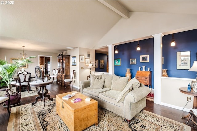 living room with lofted ceiling with beams, wood finished floors, decorative columns, and baseboards