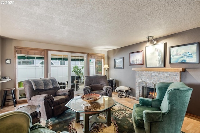 living area featuring a brick fireplace, a textured ceiling, and wood finished floors