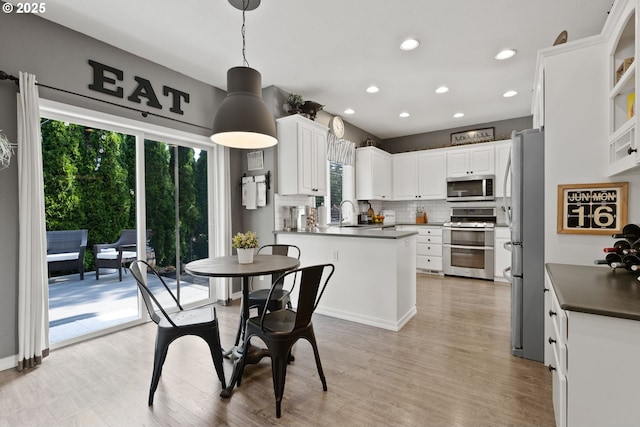 8775 SW Comanche Way, Tualatin, OR 97062 - dining room with recessed lighting and light wood finished floors