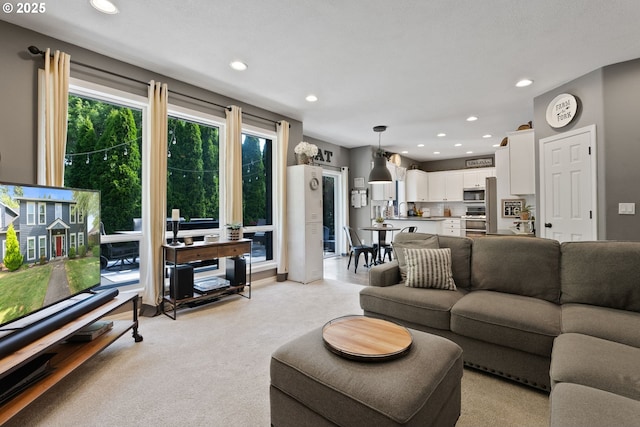 8775 SW Comanche Way, Tualatin, OR 97062 - living area with recessed lighting and light colored carpet