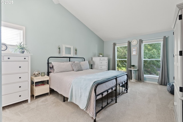 8775 SW Comanche Way, Tualatin, OR 97062 - bedroom featuring light colored carpet and high vaulted ceiling