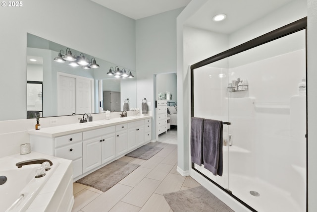 8775 SW Comanche Way, Tualatin, OR 97062 - ensuite bathroom featuring a shower stall, a garden tub, and vanity
