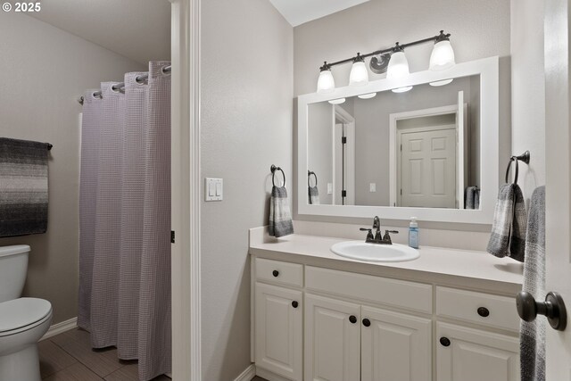 8775 SW Comanche Way, Tualatin, OR 97062 - full bathroom with vanity, a shower with shower curtain, and wood finished floors