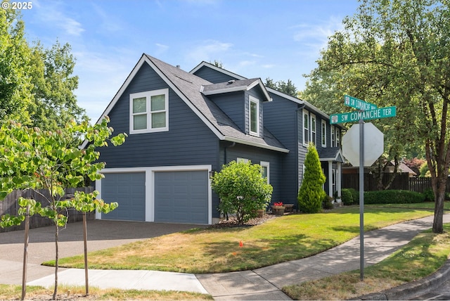 8775 SW Comanche Way, Tualatin, OR 97062 - view of front of house with an attached garage and a shingled roof