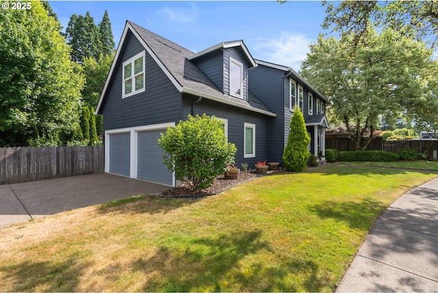 8775 SW Comanche Way, Tualatin, OR 97062 - view of front of home featuring an attached garage and driveway
