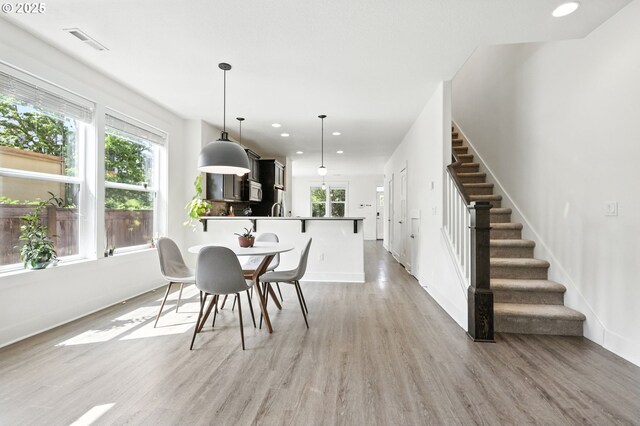 18 NE Cook St, Portland, OR 97212 - dining room with stairway, light wood finished floors, and recessed lighting