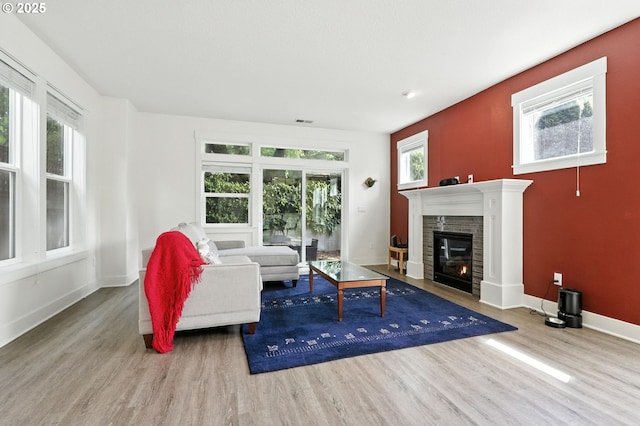 18 NE Cook St, Portland, OR 97212 - living room featuring wood finished floors and a tile fireplace