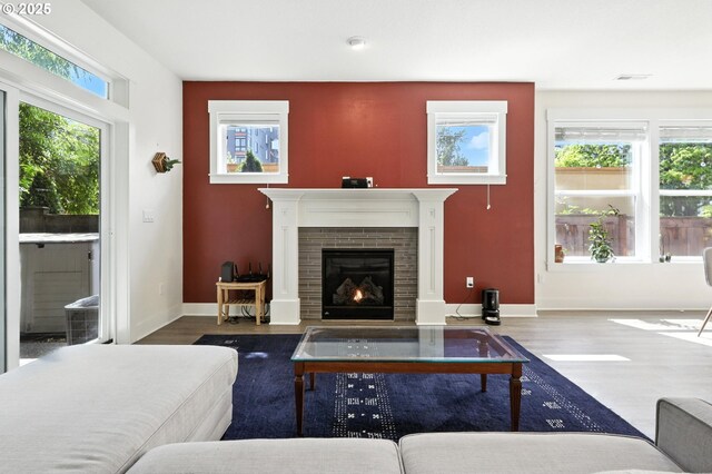 18 NE Cook St, Portland, OR 97212 - living room with wood finished floors and a lit fireplace