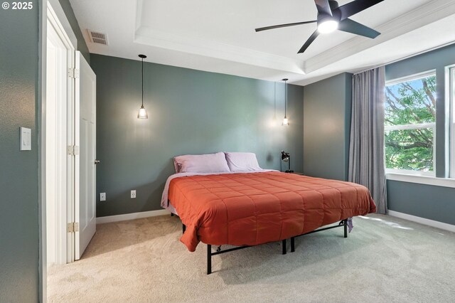 18 NE Cook St, Portland, OR 97212 - bedroom featuring a tray ceiling, carpet, ornamental molding, and a ceiling fan