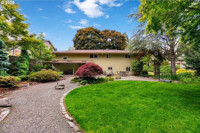 9004 SW 36th Ave, Portland, OR 97219 - rear view of house with a patio area and a yard