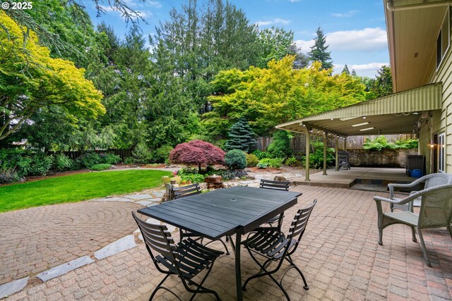 9004 SW 36th Ave, Portland, OR 97219 - view of patio / terrace with outdoor dining space and view of wooded area