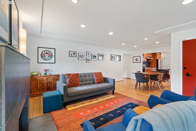 9004 SW 36th Ave, Portland, OR 97219 - living room featuring recessed lighting and wood finished floors