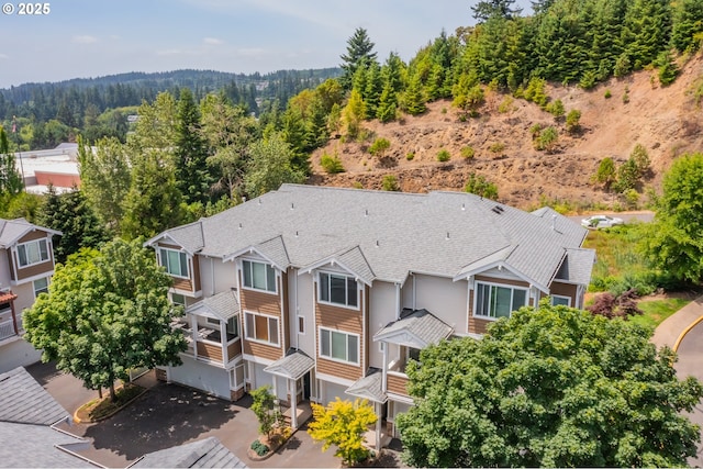 8800 SW 147th Ter Unit 103, Beaverton, OR 97007 - aerial view of property and surrounding area featuring a heavily wooded area