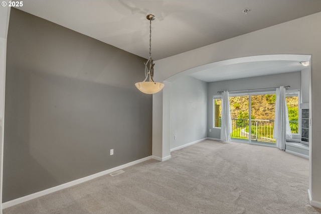 8800 SW 147th Ter Unit 103, Beaverton, OR 97007 - empty room featuring arched walkways and carpet flooring