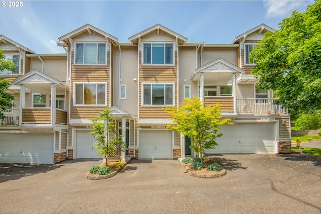 8800 SW 147th Ter Unit 103, Beaverton, OR 97007 - multi unit property with a garage, driveway, and stone siding
