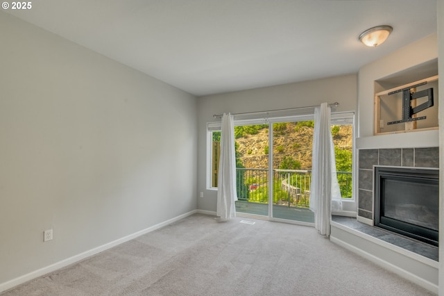 8800 SW 147th Ter Unit 103, Beaverton, OR 97007 - unfurnished living room featuring carpet and a fireplace