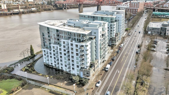 drone / aerial view featuring a water view and a city view