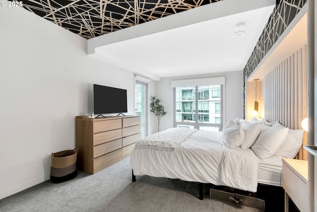 bedroom with carpet flooring and baseboards