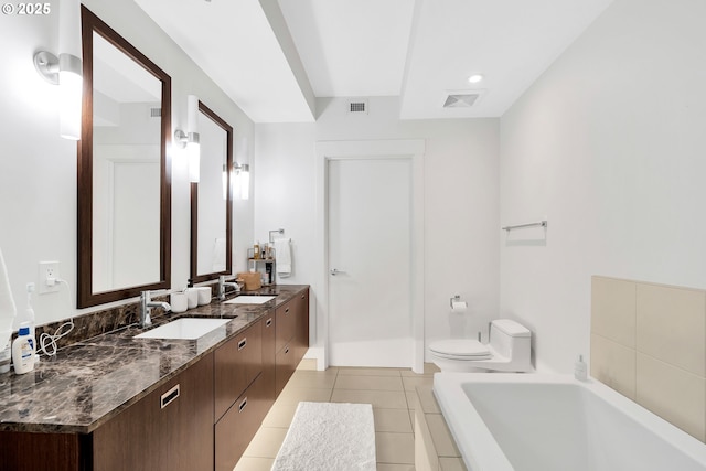 bathroom with toilet, tile patterned flooring, a sink, and visible vents