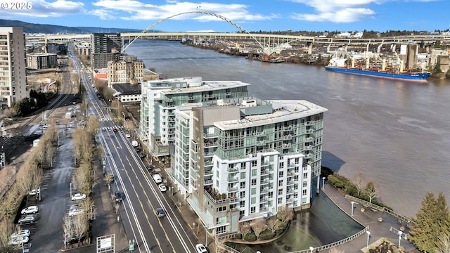 drone / aerial view with a view of city and a water view