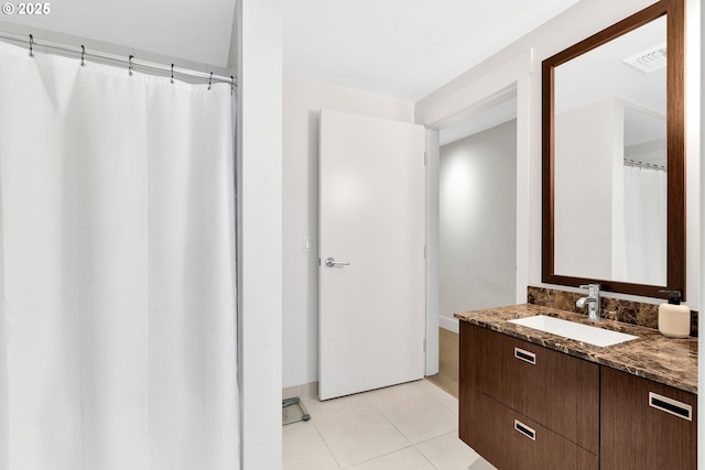 full bath featuring tile patterned floors, a shower with curtain, visible vents, and vanity