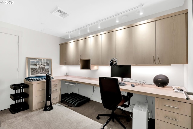 carpeted office featuring built in study area and visible vents