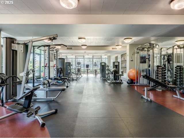 workout area with visible vents and floor to ceiling windows