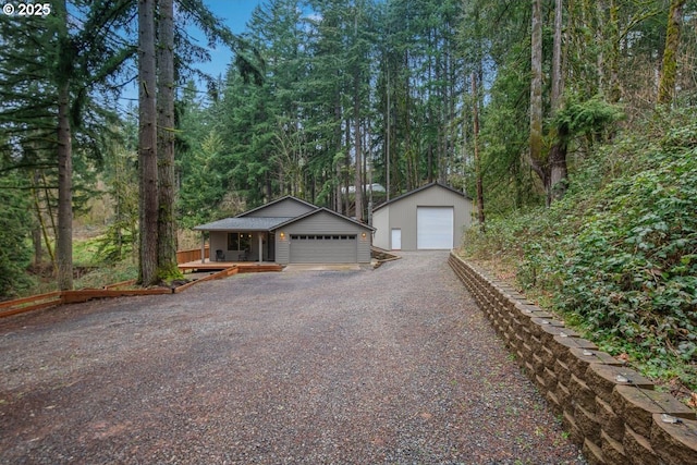 detached garage with a forest view