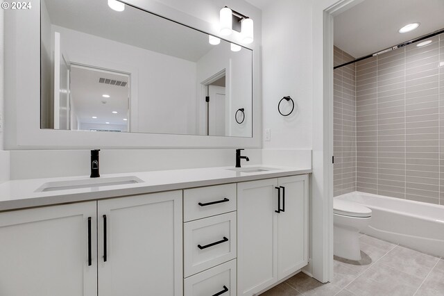 full bath featuring tile patterned flooring, visible vents, a sink, and toilet