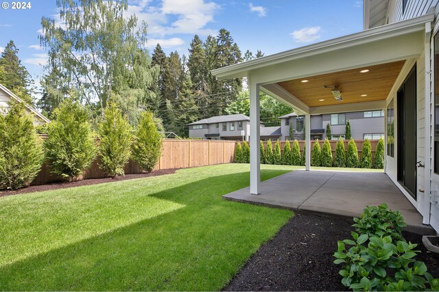 view of yard with a patio area and fence