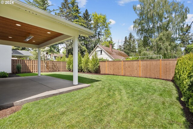 view of yard with a fenced backyard and a patio