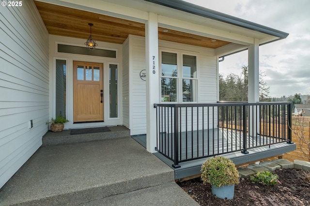 doorway to property featuring covered porch