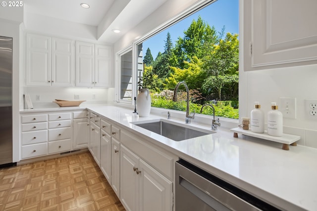 1890 S Greenwood Rd, Portland, OR 97219 - kitchen with dishwasher, a sink, plenty of natural light, light countertops, and recessed lighting