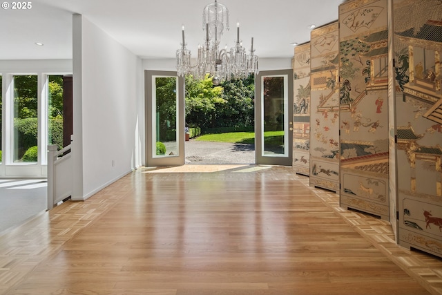 1890 S Greenwood Rd, Portland, OR 97219 - unfurnished dining area with a chandelier, healthy amount of natural light, light wood-style flooring, recessed lighting, and baseboards