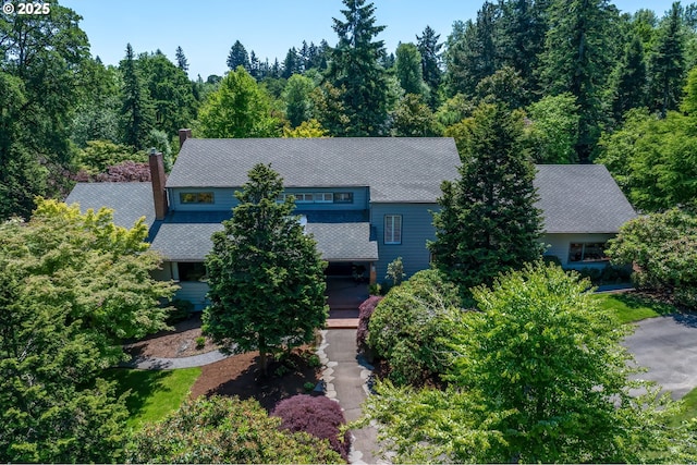 1890 S Greenwood Rd, Portland, OR 97219 - view of front facade featuring a chimney and a forest view