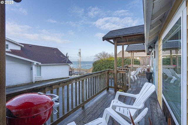 wooden deck with a water view