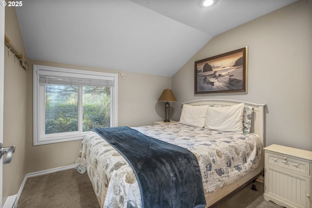 carpeted bedroom with a baseboard radiator, vaulted ceiling, and baseboards