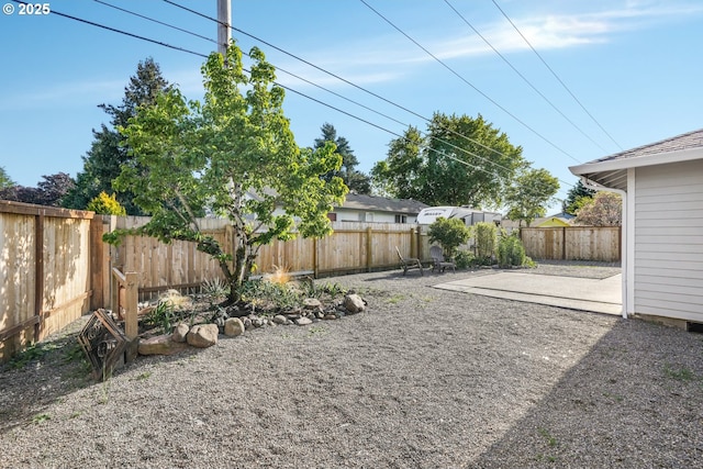 fenced backyard featuring a patio