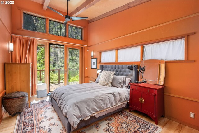 49348 Mckenzie Hwy, Vida, OR 97488 - bedroom with beamed ceiling, access to outside, light wood-style floors, a high ceiling, and baseboards
