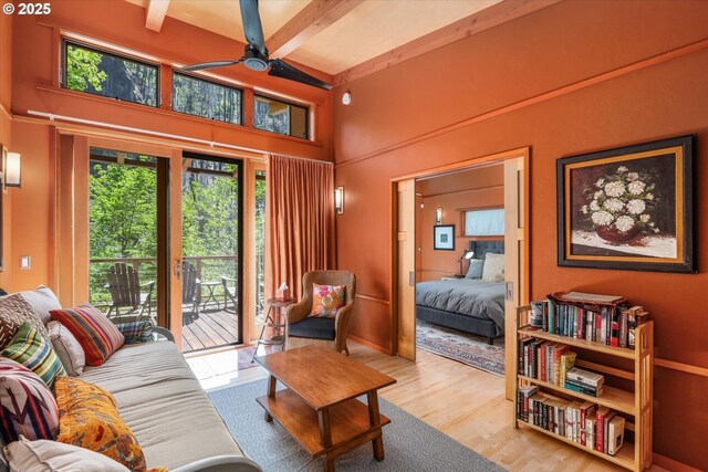 49348 Mckenzie Hwy, Vida, OR 97488 - living area featuring ceiling fan, beam ceiling, wood finished floors, and a towering ceiling