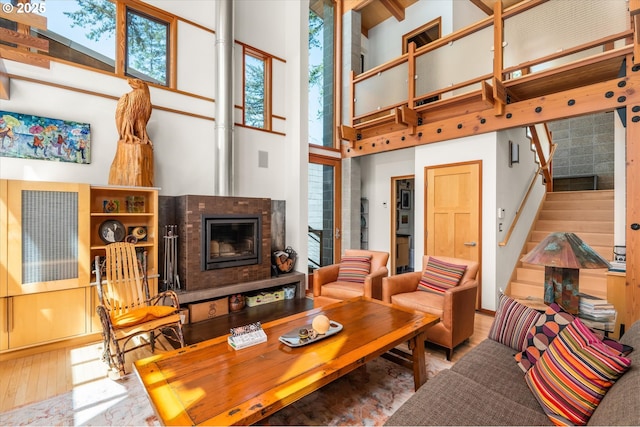 49348 Mckenzie Hwy, Vida, OR 97488 - living area featuring a high ceiling, wood-type flooring, and stairway