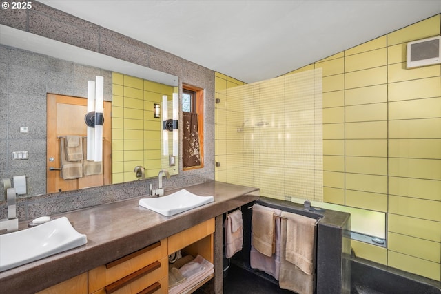 49348 Mckenzie Hwy, Vida, OR 97488 - bathroom with tile walls, double vanity, and tasteful backsplash