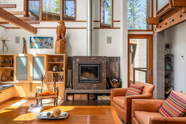 49348 Mckenzie Hwy, Vida, OR 97488 - sitting room with healthy amount of natural light, hardwood / wood-style flooring, and a towering ceiling