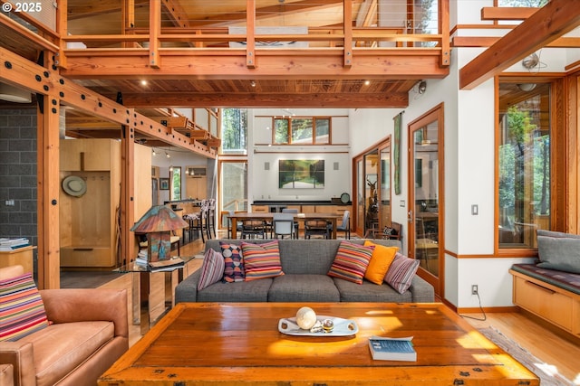 49348 Mckenzie Hwy, Vida, OR 97488 - living room with beamed ceiling, wood finished floors, baseboards, and wood ceiling