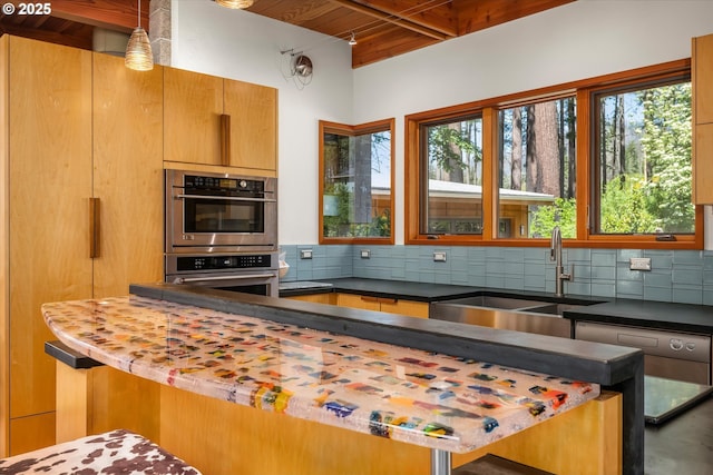 49348 Mckenzie Hwy, Vida, OR 97488 - kitchen with a sink, beam ceiling, decorative backsplash, wood ceiling, and double oven