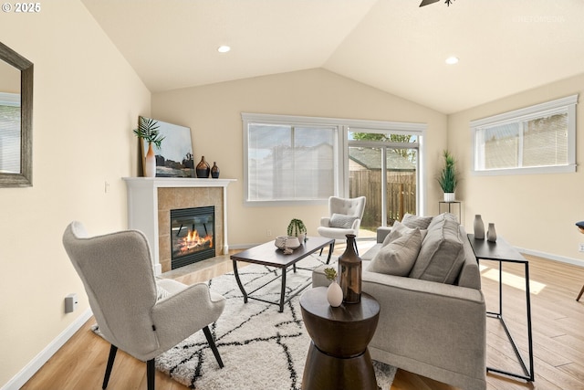 31070 NW Kaybern St, North Plains, OR 97133 - living room with light wood finished floors, lofted ceiling, a tiled fireplace, and recessed lighting
