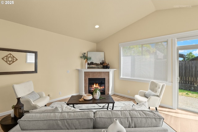31070 NW Kaybern St, North Plains, OR 97133 - living area with lofted ceiling, wood finished floors, healthy amount of natural light, a tile fireplace, and recessed lighting
