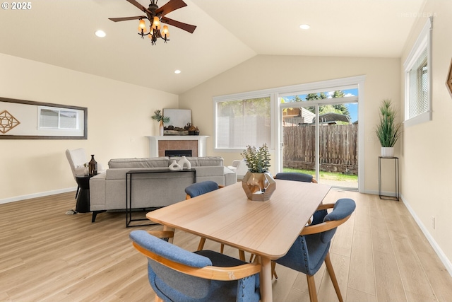 31070 NW Kaybern St, North Plains, OR 97133 - dining room featuring light wood-style floors, vaulted ceiling, a fireplace, a ceiling fan, and recessed lighting