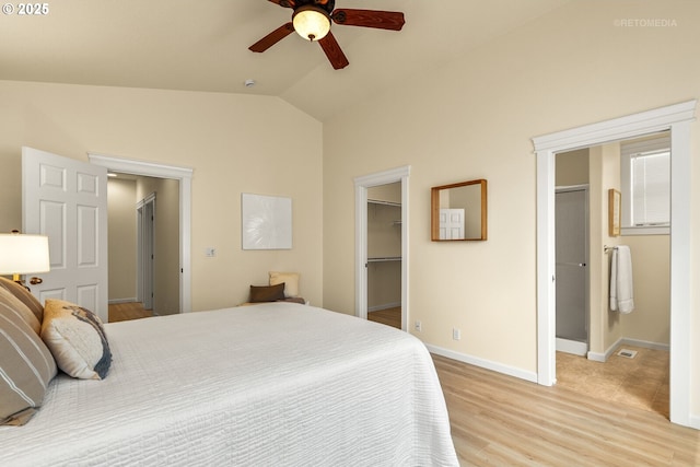 31070 NW Kaybern St, North Plains, OR 97133 - bedroom with a walk in closet, lofted ceiling, light wood-style floors, a closet, and ensuite bathroom
